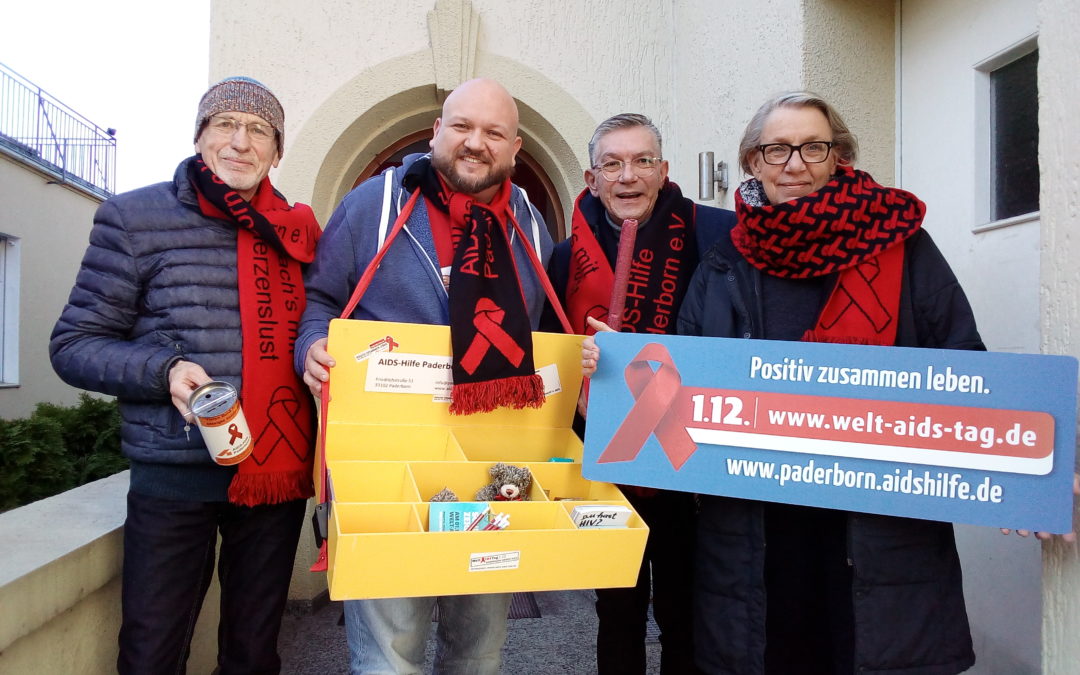 Wilfried Dör, Thorsten Driller, Michael Volmerhaus und Lena Arndt bereiten sich auf den Welt-Aids-Tag vor